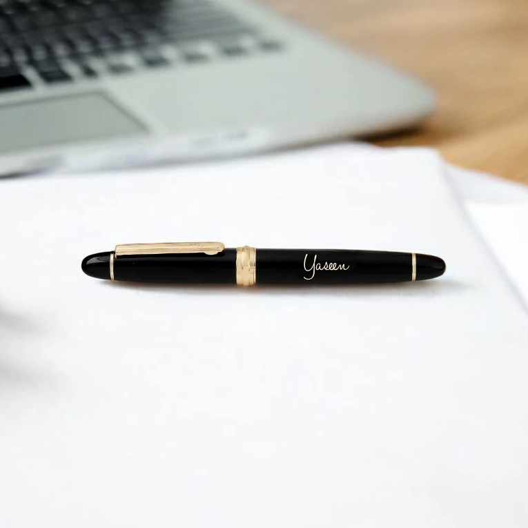 Elegant black and gold personalized pen engraved with 'Yaseen' from the Personalized Pen Gift Box - ideal for professional desk setups.