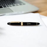 Elegant black and gold personalized pen engraved with 'Yaseen' from the Personalized Pen Gift Box - ideal for professional desk setups.