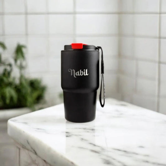 Custom Not Your Habibi Sipper in black with name 'Nabil' engraved, placed on a marble counter, perfect for personalized drinkware gifting.