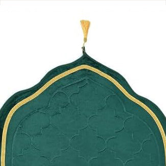 Close-up of the dome-shaped top of the Green Dome Janamaz with golden trim and tassel, highlighting its elegant Islamic design.
