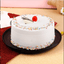 Vanilla Cake - Moist Delight with whipped cream frosting, decorated with rainbow sprinkles and cherry on top, ideal for same day delivery.
