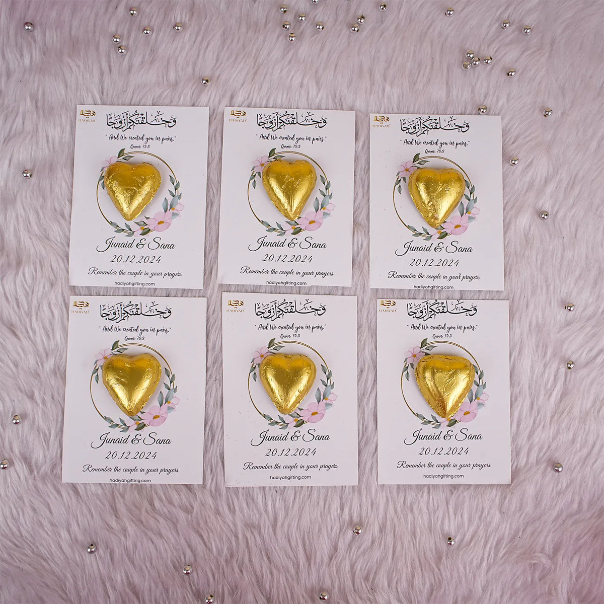 Set of six customized chocolate wedding favors for Nikah with gold heart chocolates and floral cards, perfect for Islamic wedding celebrations.