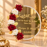 Gold nikah mirror plaque with red and ivory roses, golden leaves and decorative Quranic wedding lettering.