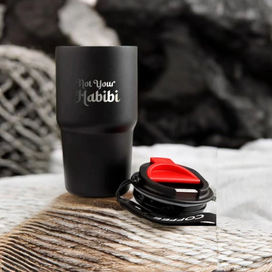 Not Your Habibi Sipper - Personalized Black tumbler with quirky text, ideal for gifting or daily use, shown with detachable lid on a woven surface.