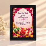 Wedding frame featuring miniature dholkis, flowers and personalised couple names