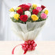 Modern Romance - Premium Mixed Rose Bouquet with red, yellow, white, and pink roses, wrapped in white paper and tied with a red ribbon.