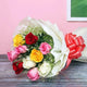 Modern Romance - Stylish Mixed Rose Arrangement with 10 premium roses in vibrant colors, wrapped in white paper and finished with an orange bow.
