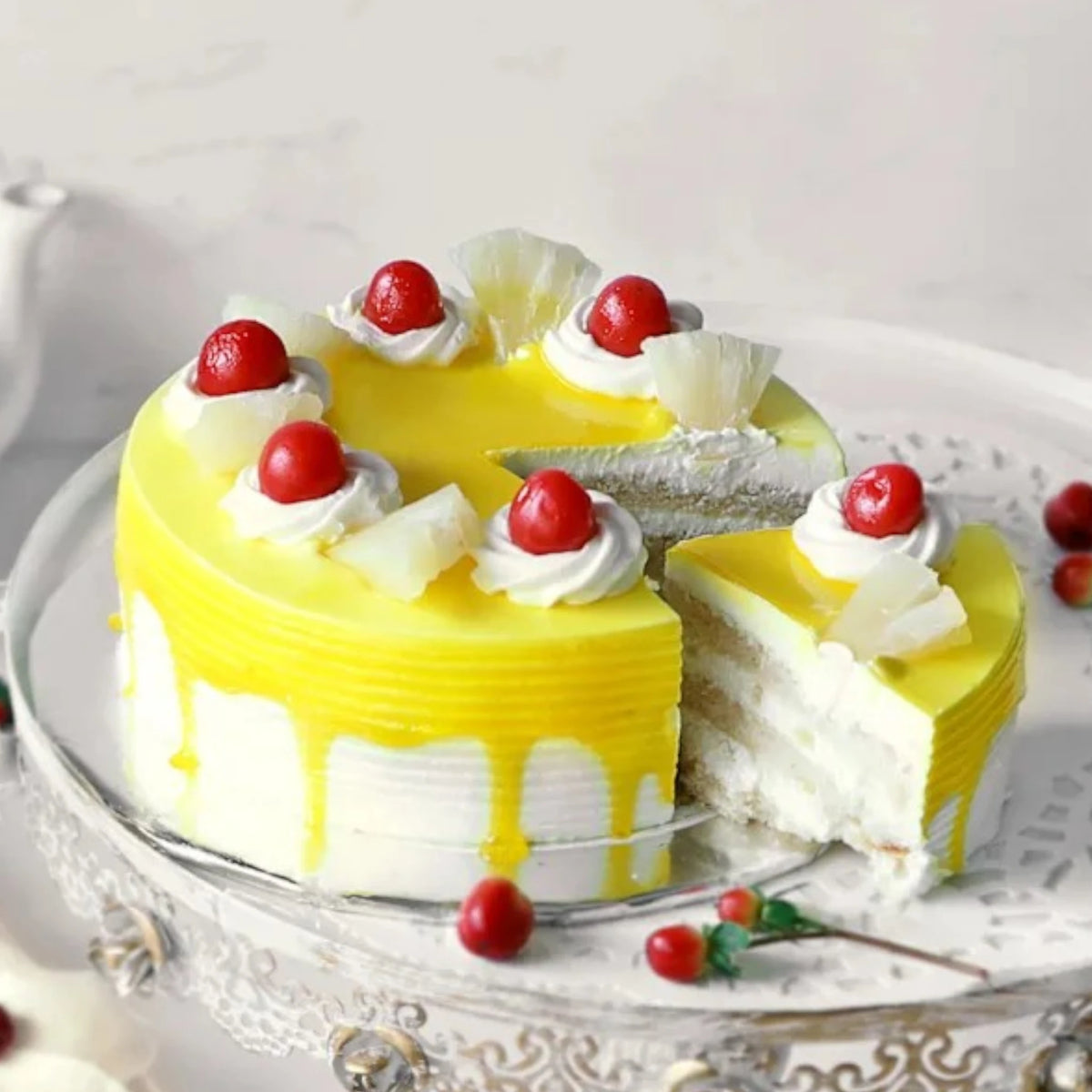 Sliced Delicious Pineapple Cake with layers of cream and pineapple chunks. Ideal fruity treat for same day delivery and special occasions.
