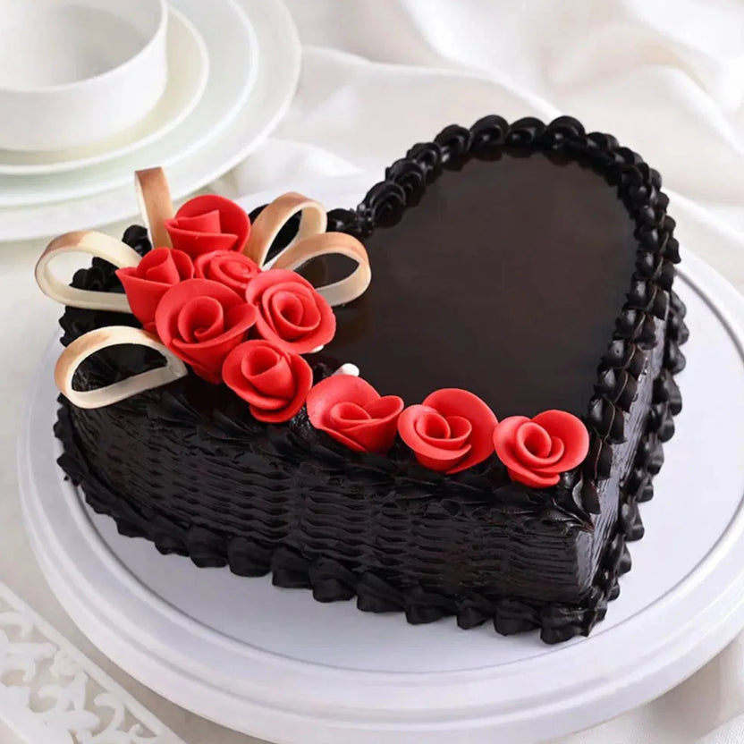 Toothsome Chocolate Cake - Delicious Treats | Rich Flavor, heart-shaped with glossy chocolate glaze and red rose decorations, perfect for anniversaries. Main image
