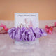 Lavender satin scrunchie favor on custom bridal shower card with floral and bride artwork, elegant gift for wedding celebrations.