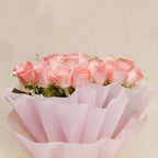 Lush bouquet of soft pink roses in delicate wrapping, ideal for Women's Day or appreciation gifts. Order this graceful floral arrangement today.