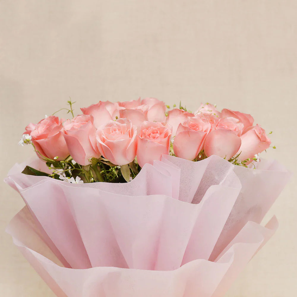 Lush bouquet of soft pink roses in delicate wrapping, ideal for Women's Day or appreciation gifts. Order this graceful floral arrangement today.