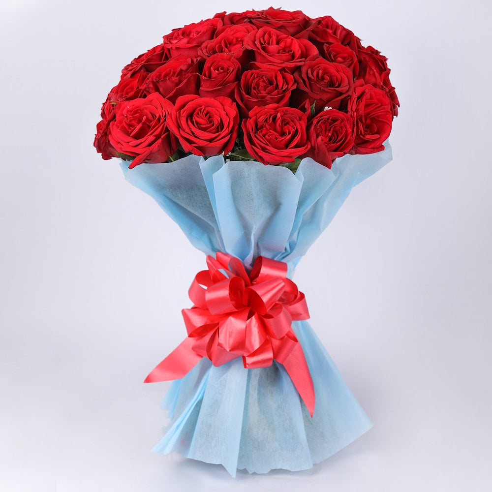 Classic Aura 12 Red Roses Bouquet — detail of the flowers and wrapping