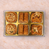 Decorative box of luxury Baklava sweets with nuts and syrup