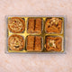 Decorative box of luxury Baklava sweets with nuts and syrup