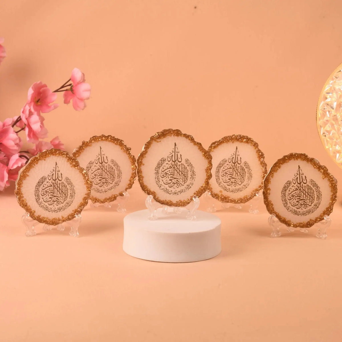 Set of five 3" Ayatul Kursi Frames with gold-trimmed edges, handmade in India, displayed on clear stands for Islamic home decor or gifting.
