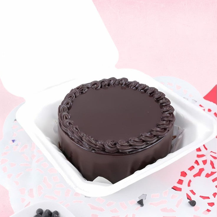 Mini Chocolate Cake 300g with glossy ganache and piped border, ideal for 1-2 servings, presented in a white takeaway box. Main image