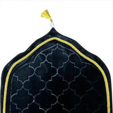 Black Dome Janamaz with golden trim and tassel, showcasing elegant dome shape and luxurious texture for premium prayer experience.