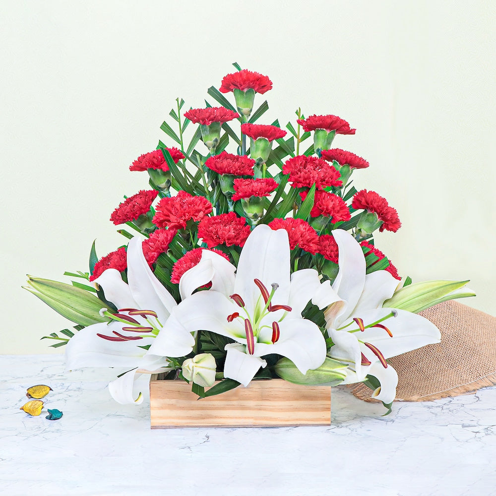 Carnations and Lilies Bouquet - Elegant Floral Arrangement featuring vibrant red carnations and white lilies in a wooden box. Ideal for anniversaries or condolences. Main image
