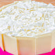 Close-up of Snow Sweet Whiteforest Cake featuring creamy white chocolate flakes and smooth vanilla layers, perfect for gifting and same day delivery.