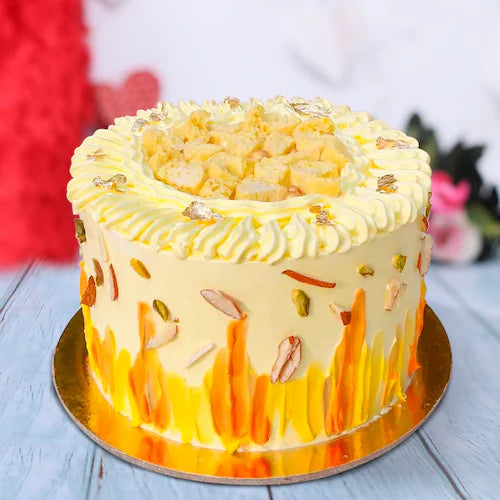 Buy Delicious Rasmalai Cake with creamy saffron frosting, nuts, and rasmalai topping. Ideal for anniversaries and same day delivery.