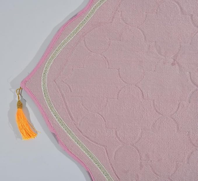 Detailed view of Pink Dome Janamaz top with orange tassel and elegant arch pattern, highlighting premium craftsmanship.