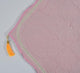Detailed view of Pink Dome Janamaz top with orange tassel and elegant arch pattern, highlighting premium craftsmanship.