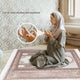 Muslim woman praying with Noor Zikr Ring - Smart Tasbeeh. Can be used anytime, anywhere for spiritual mindfulness and Zikr.