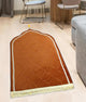 Golden Dome Janamaz - Dome Shaped Prayer Mat placed in a modern living room, ideal for Islamic prayers and gifting.