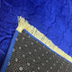 Close-up of Blue Dome Janamaz showing soft velvet texture, gold fringe, and non-slip backing. Premium personalized prayer rug.