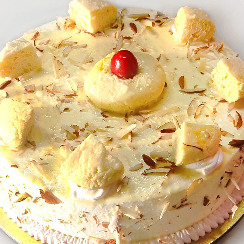 Close-up of Super Rasmalai Cake with creamy saffron glaze, cardamom flavor, and rich toppings. Order Rasmalai Cake online for same day delivery.