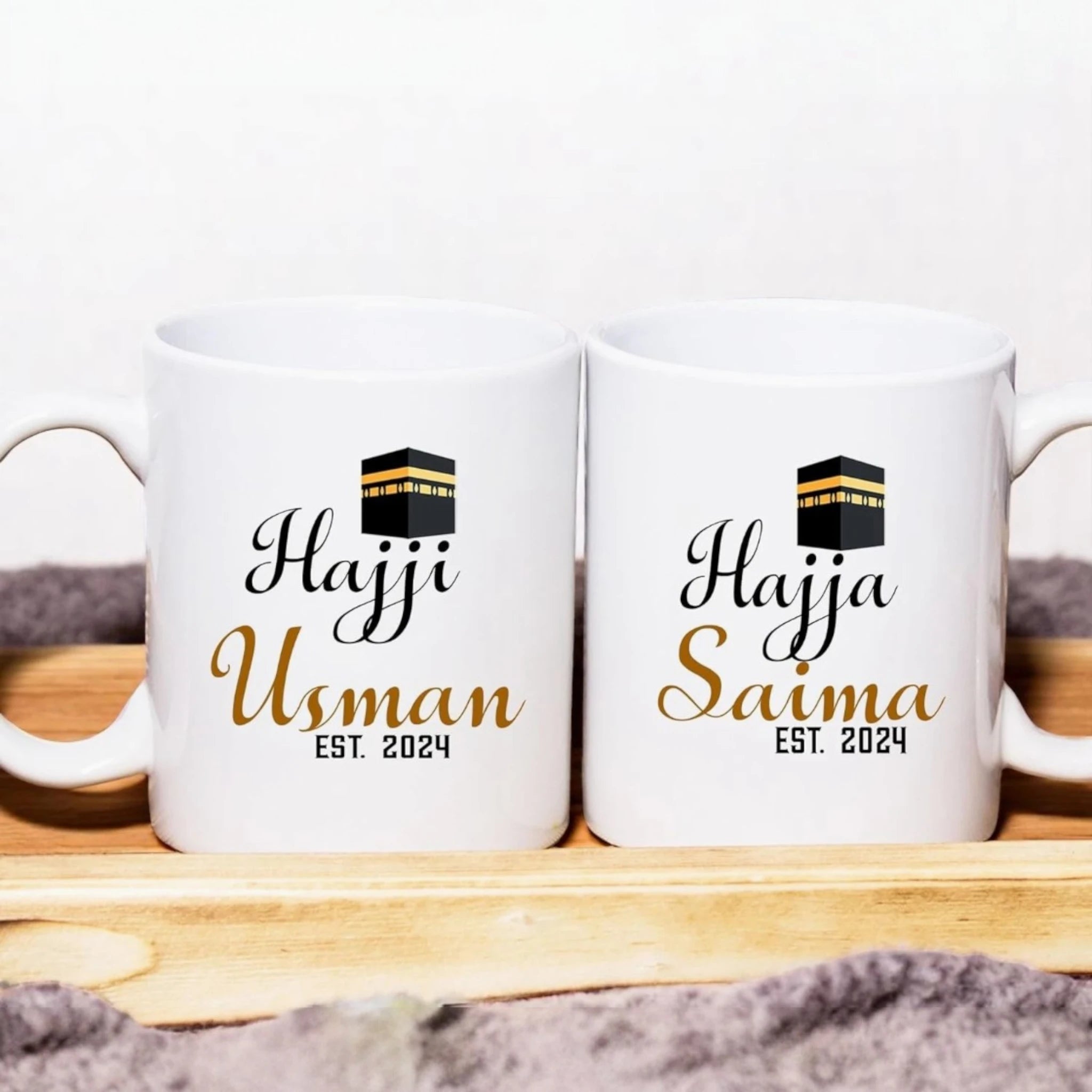 Hajji Hajja custom mugs set featuring names Usman and Saima with Kaaba icon. Personalized ceramic mugs, microwave safe, perfect Hajj gift. Main image