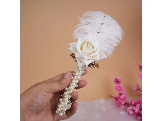 Elegant Islamic Nikah Pen Gift with white rose, pearl embellishments, and feather accent, perfect for wedding ceremony signing.