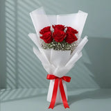 6 Red Roses Bouquet arranged in packaging, close-up