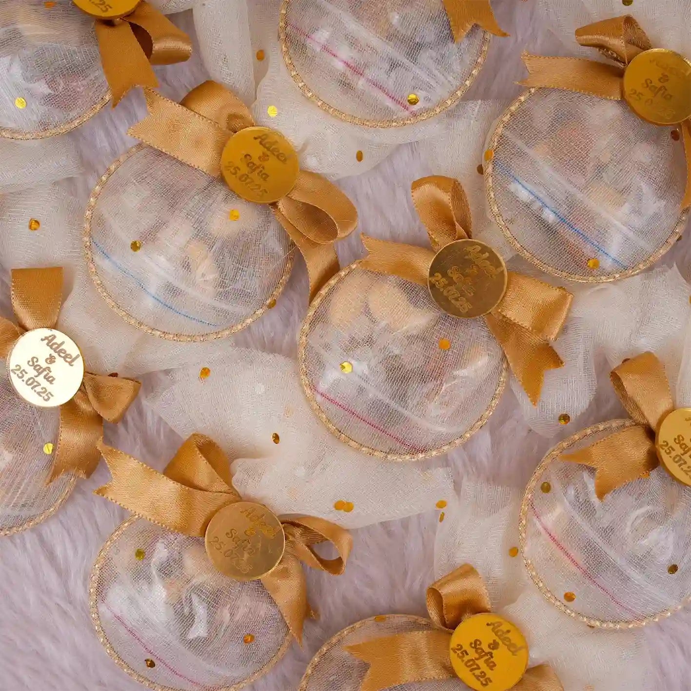 Golden Heart Nikah Favors with personalized tags and satin bows, ideal for wedding ceremonies and Nikah celebrations. Elegant mesh pouches filled with dry fruits. Main image
