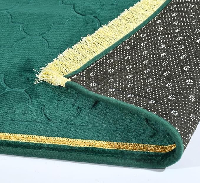 Bottom view of Green Dome Janamaz showing anti-slip backing and golden fringe, combining safety and style for prayer use.