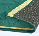 Bottom view of Green Dome Janamaz showing anti-slip backing and golden fringe, combining safety and style for prayer use.