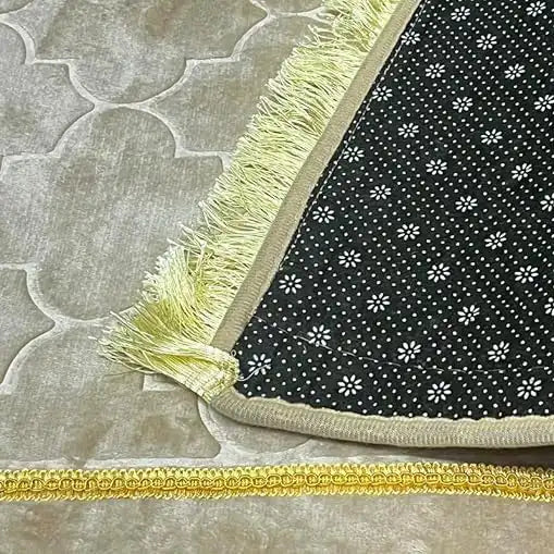 Backside of Grey Dome Janamaz with anti-slip dotted base and golden fringe, ensuring stability and style during prayers. High-quality stitching visible.