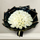 Lush Peaceful White Roses Bouquet of 100 stems in black and gold wrapping, symbolizing purity and peace for gifting or memorial events.