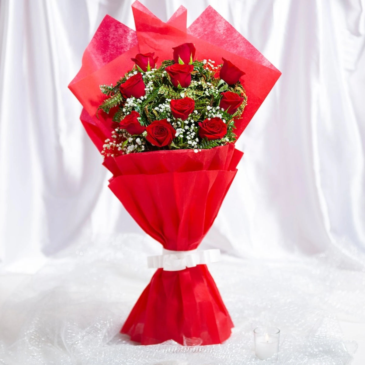 Blooming Insight - Bright Bloom Bouquet of 10 red roses and seasonal fillers in red 2-layer wrap, ideal for anniversaries and same day delivery gifts.