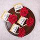 Haldi e Haya Floral Favors featuring red rose hand bracelets with pearl bands and personalized 'Aliya ki Haldi' cards, ideal for wedding celebrations.
