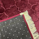 Detailed view of Maroon Dome Prayer Mat’s non-slip backing and golden fringe, highlighting premium craftsmanship and durability.