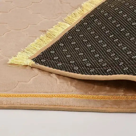 Detailed view of Offwhite Dome Janamaz backing and fringe. Anti-slip base and golden trim enhance comfort and style for prayer.