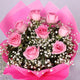 Exotic Pink Roses Bouquet featuring 8 pink roses with white baby's breath and green fillers, wrapped in pink paper. Express affection with this floral gift.