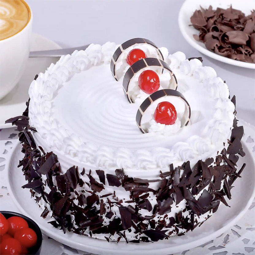 Black Forest Cake Online - Order Now | Chocolate & Cherry Delight featuring whipped cream, chocolate shavings, and cherries on top. Ideal for anniversaries. Main image