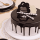 Side angle of Mouth Melting Chocolate Cake - Indulgent Layers showing rich chocolate drip, elegant toppings, and smooth round finish.