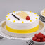 Yummy Pineapple Cake - Tropical Pineapple Cake with whipped cream, yellow frosting, cherry, and pineapple bits, perfect for celebrations.