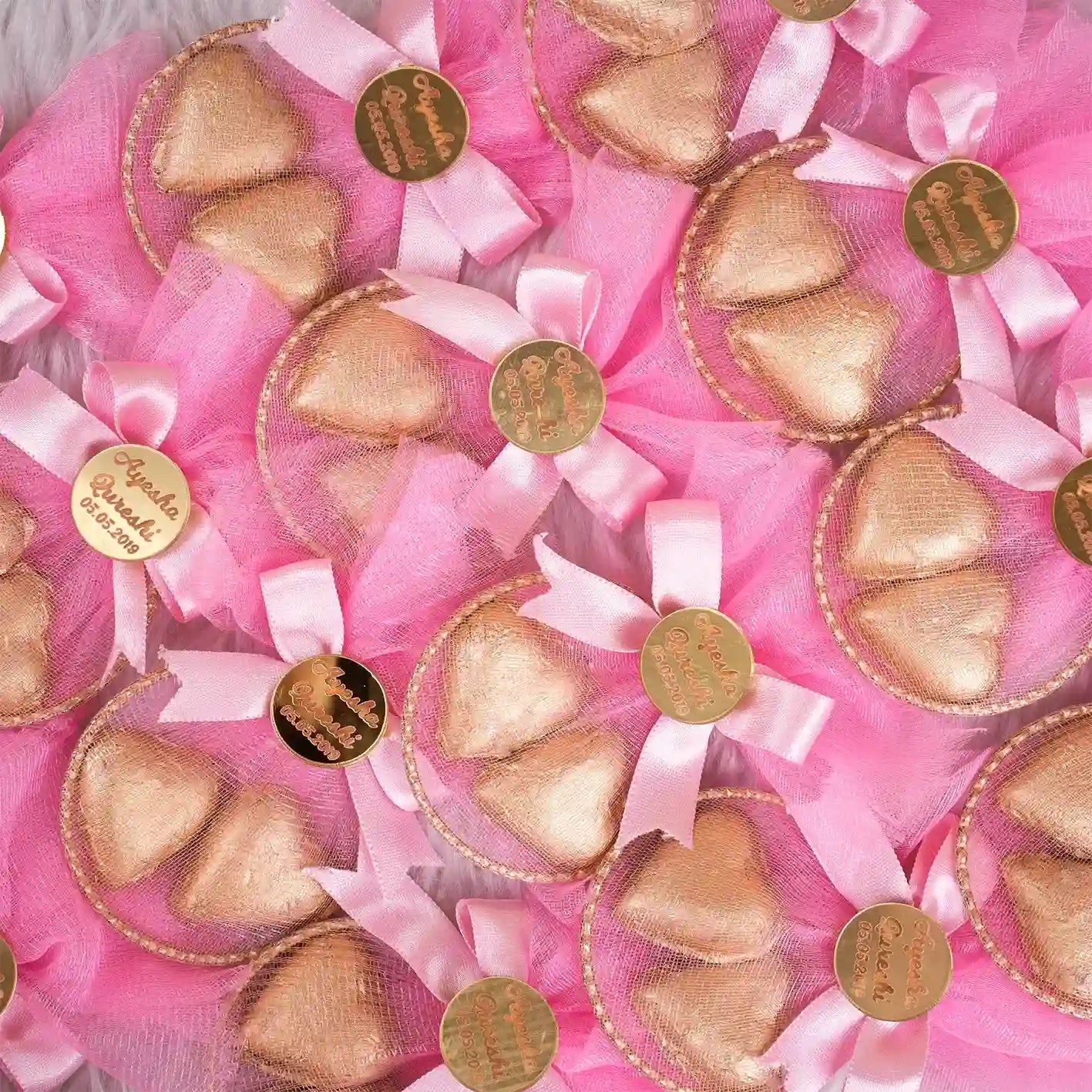 Aqiqah Golden Hearts Favor in pink with gold-wrapped heart chocolates and custom tags, ideal for wedding or nikah favors.