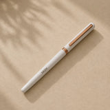 White displayed alongside its gift box