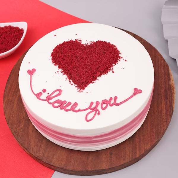Red Velvet Romance Cake with heart-shaped red crumbs and 'I love you' icing, ideal for anniversaries and romantic celebrations. Main image